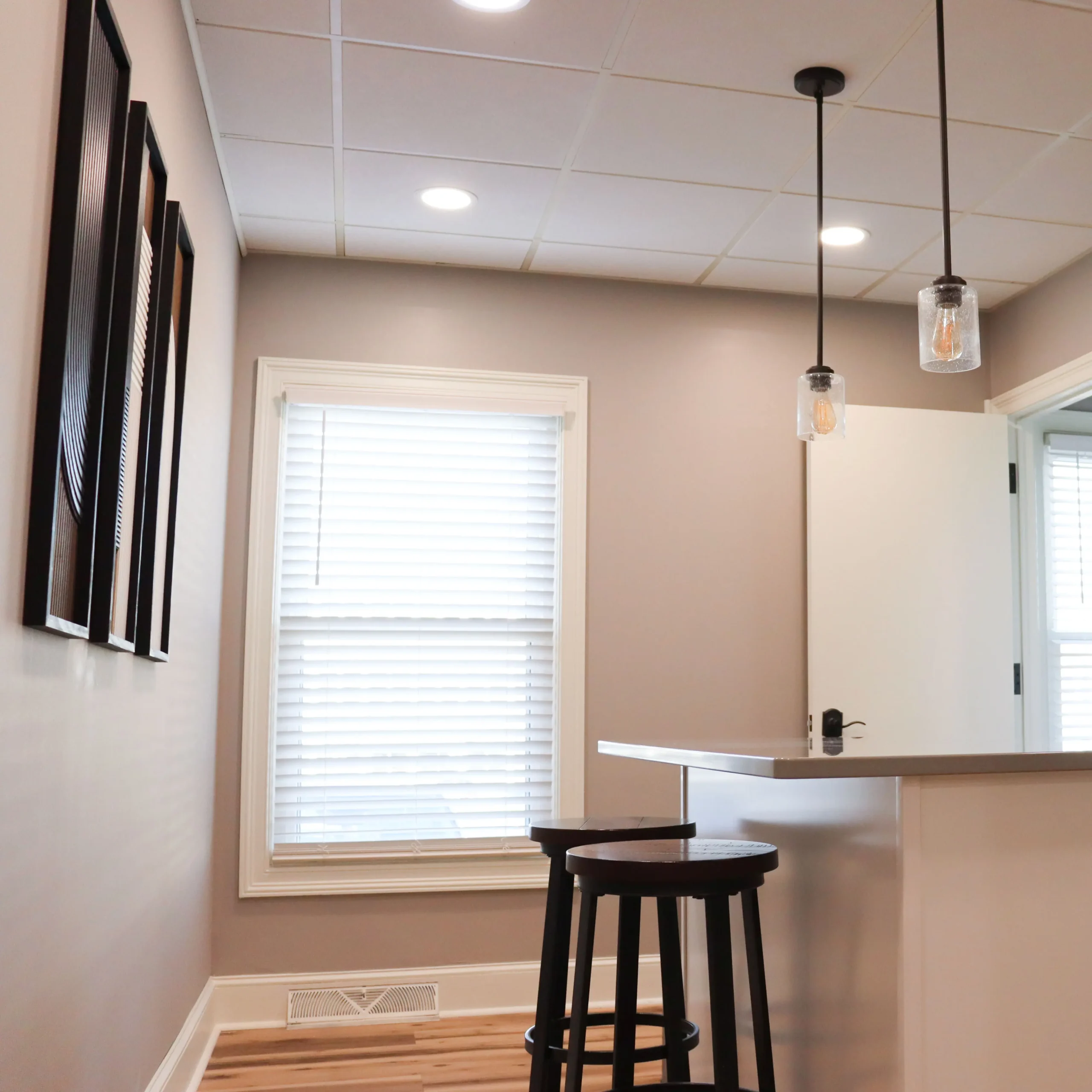 Kitchen in Suite 102 with an island and barstools for coworking and breaks